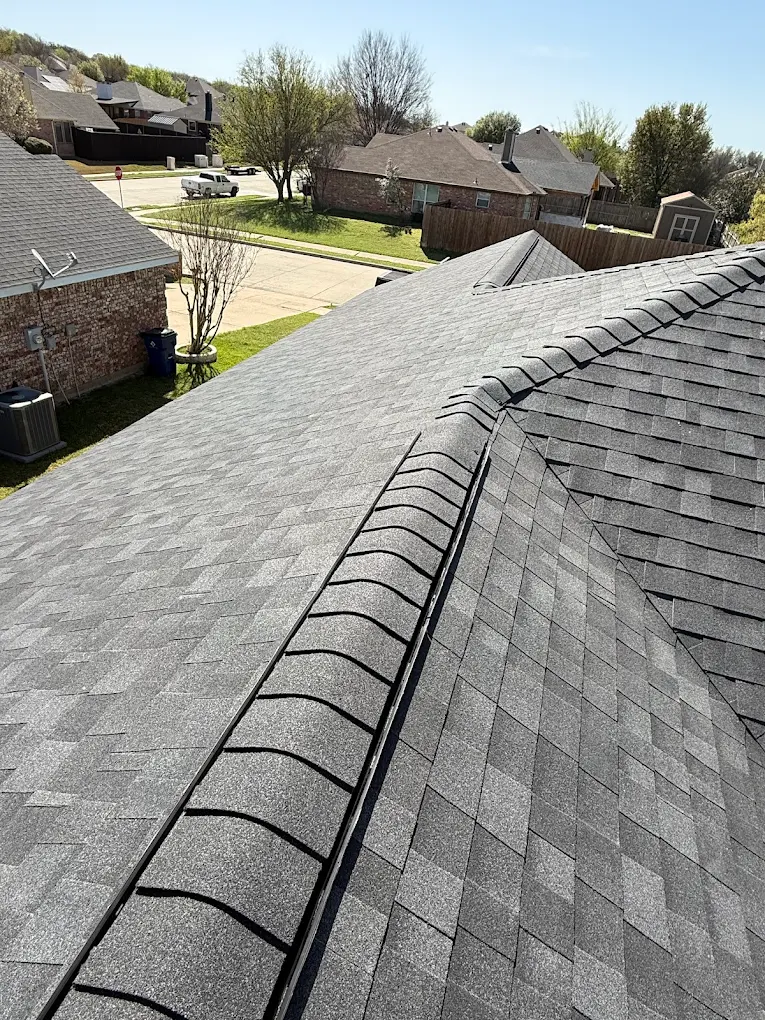 Gray dimensional shingle roof with ridge vent