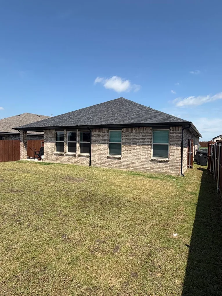 Completed roof replacement on brick home