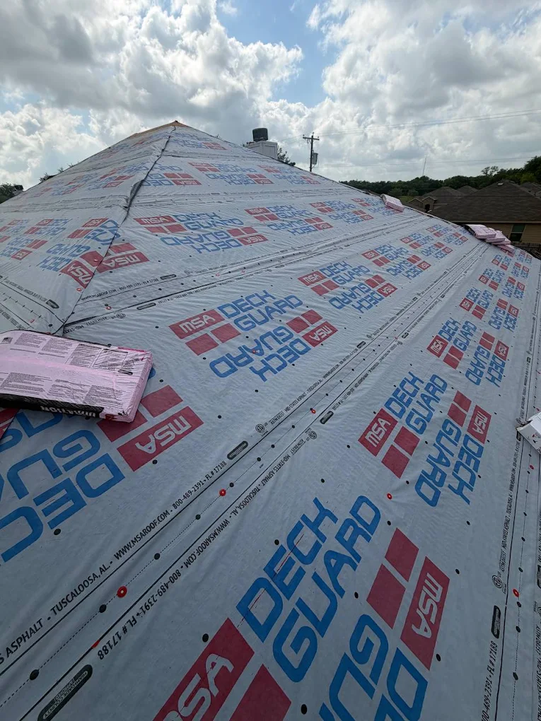 Synthetic underlayment installed across roof deck