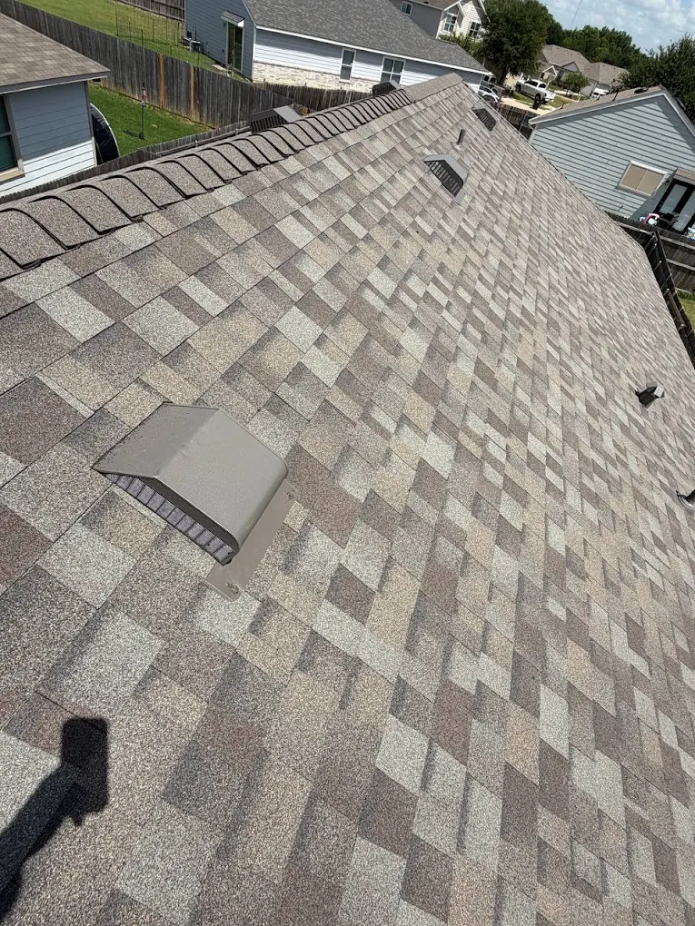 Finished shingle roof with roof vents installed